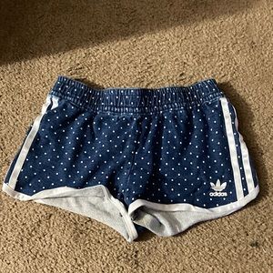 These are Adidas blue and white shirts got little polka dots, the size is a M